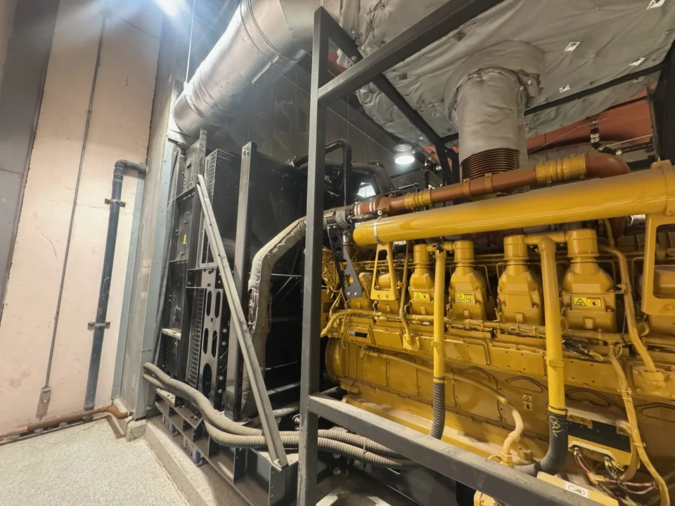 Caterpillar 3516C engine and radiator assembly in the supplied indoor installation photos